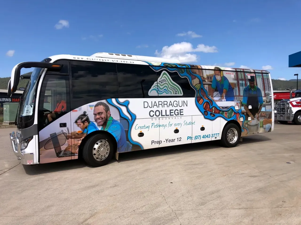 Djarragun College King Long coach featuring First Nations community artwork, built and delivered by Bus Stop Sales & Service