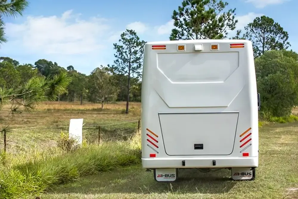 I-Bus rear — full-width locker and hi-vis reflectors