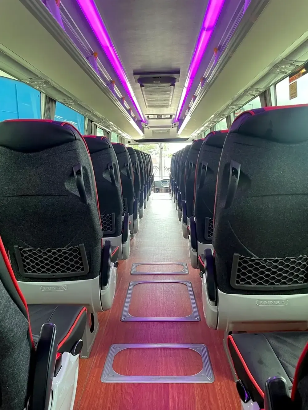 Coach interior — Fainsa reclining seats, three-point belts