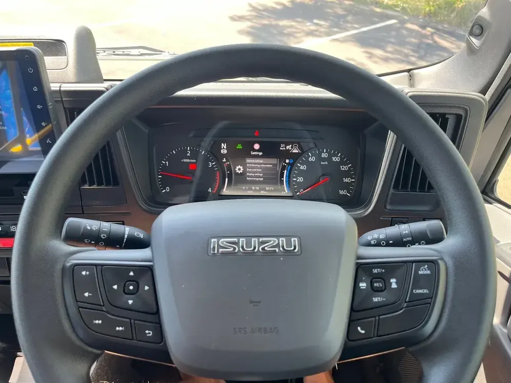 Isuzu cockpit — digital cluster and SRS airbag, built on the proven Isuzu chassis