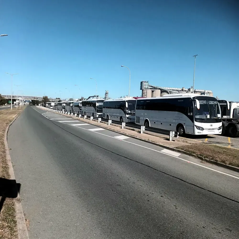 A fleet of King Long coaches, lined up for delivery