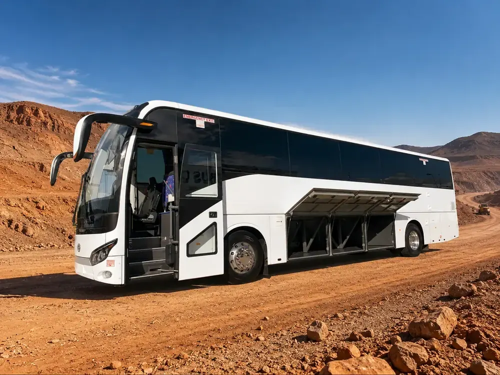 King Long coach on the haul road — underfloor storage open